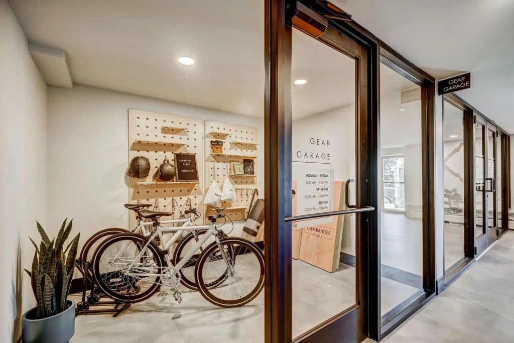 Gear Garage with bikes, helmets, and corn hole boards