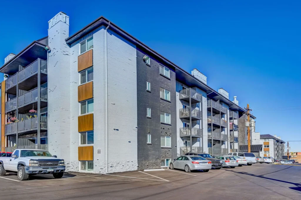 Building exterior with cars in the parking lot